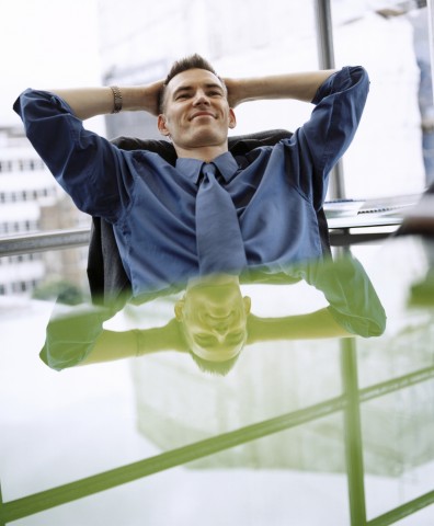 Confident Man Sitting at Desk