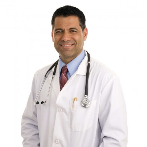 A Forty-Something Doctor in a White Coat and a Stethoscope Around His Neck.