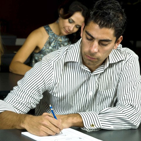 Man and Woman Writing Something Down