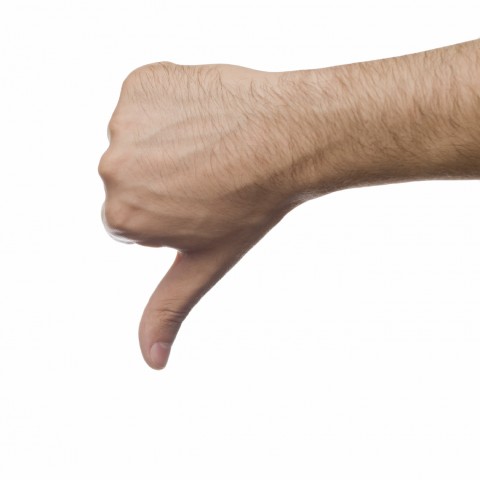 A Man Giving the Thumbs-down Gesture