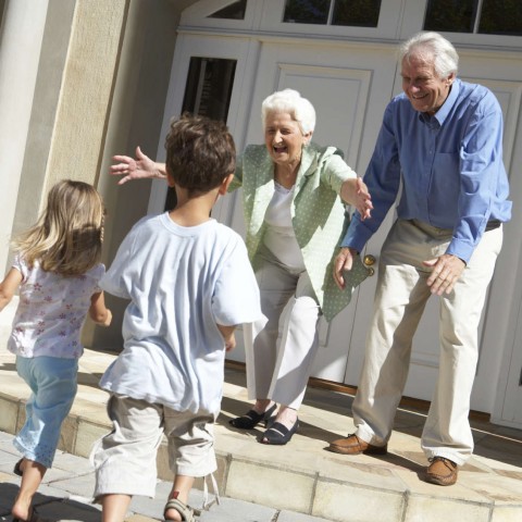 Grandparents about to Hug Their Grandchildren