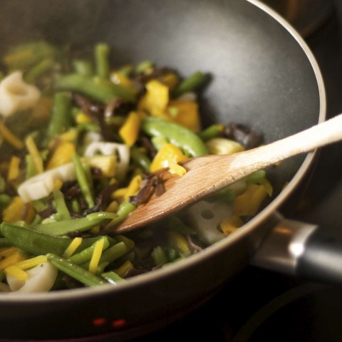 Someone Stir Frying Vegetables