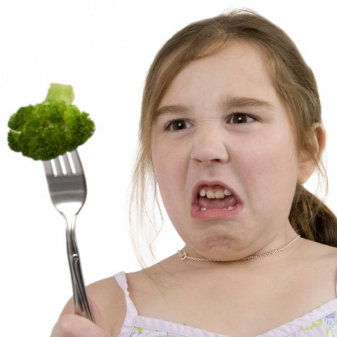 A Girl Staring in Horror at a Piece of Broccoli