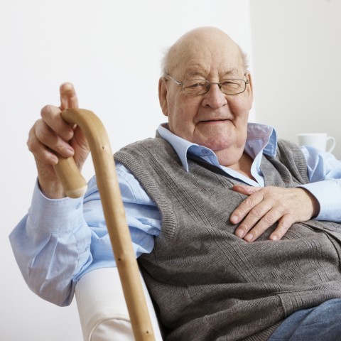 An Elderly Man Holding a Cane