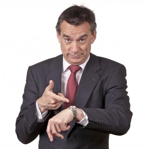 A Man Pointing at His Wristwatch