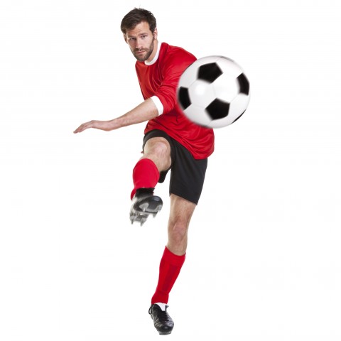 A Soccer Player Kicking a Soccer Ball