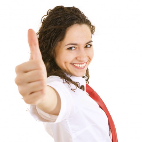 Smiling woman giving a thumbs-up